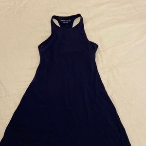 Outdoor Voices navy blue exercise dress with cutout back.